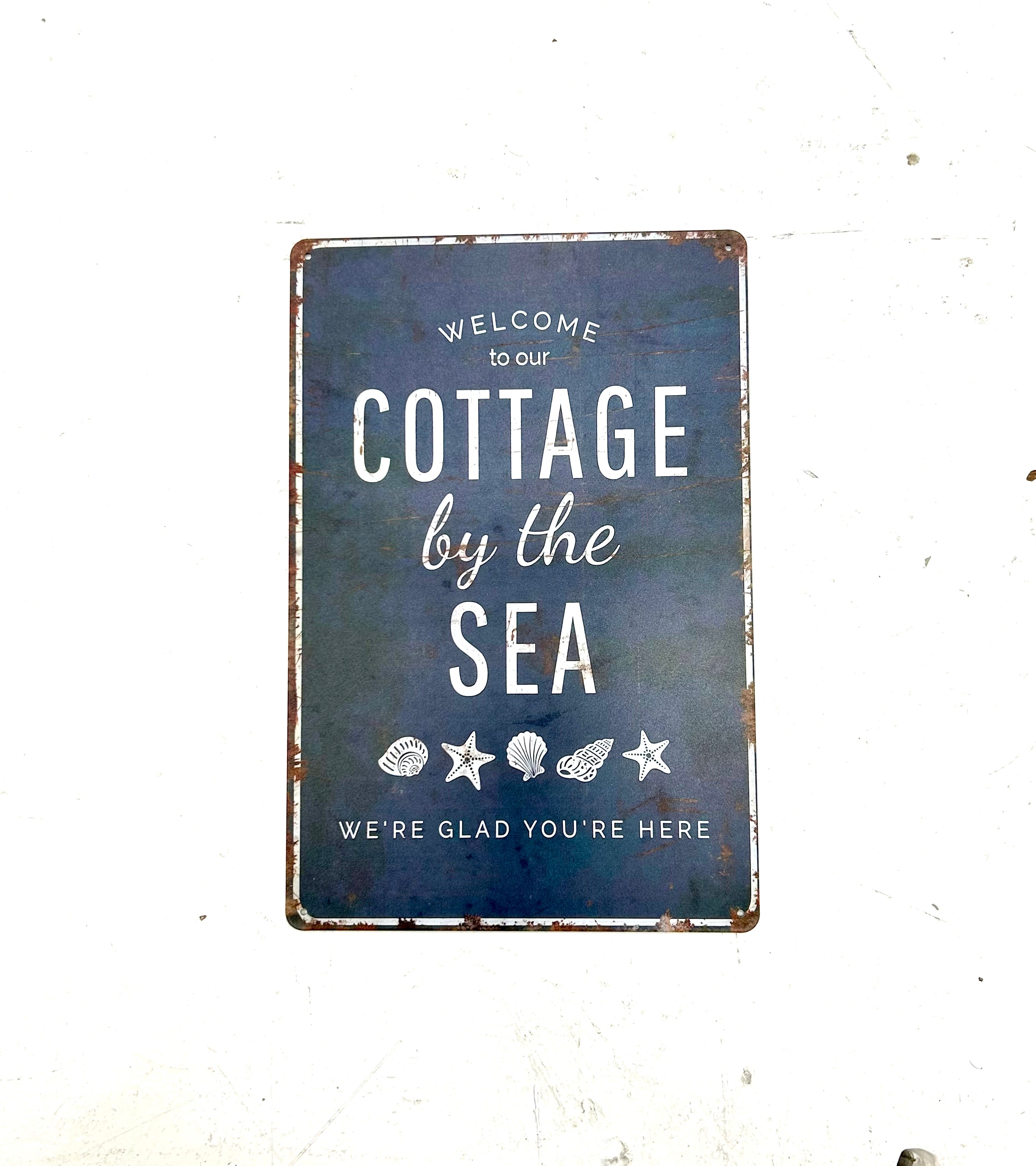 Vintage-Schild „Willkommen im Strandhaus“